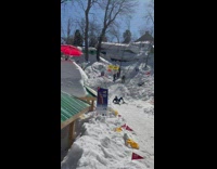 Guy skiing down hill keeps losing balance