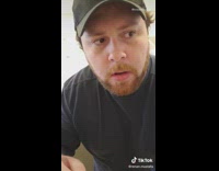 Guy opens refrigerator water beer bottle sings 