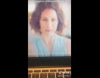 Red shirt girl shows off neck statement 