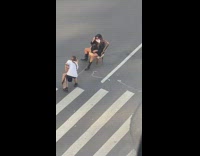 Girl sit chair middle street face mask protest