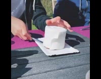 Guy cuts toilet paper cake pink placemat 