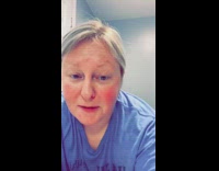 Cat drinks water from bathroom sink girl