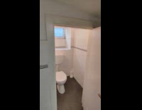 Small entrance bathroom door inside the restaurant