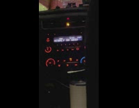 Guy rides Uber with sign on a the radio