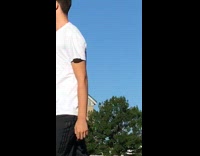 Friends throw football ball white shirt guy