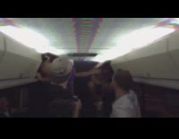 guys hiding in overhead bins on bus