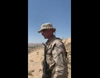Soldier with lizard sit behind his hat