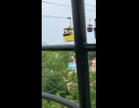Yellow gondola lift guy yells green shirt 