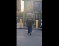 Collab WINY - Man walks with a weird head accessory 