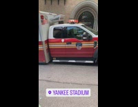 FDNY ambulance with rear tire stuck inside of sinkhole