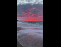 GIrl running down street chasing red sky sunset at ends up at beach