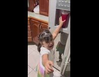 Little girl cries for help as ice overflows cup at ice dispenser