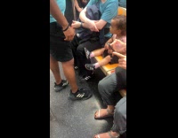 Three people same shoes inside subway train