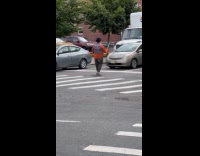 Collab WINY - Man juggles pins in red light crosswalk