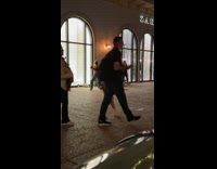 Woman red top tiktok dance outside store