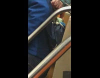 Guy has baby yoda doll in backpack