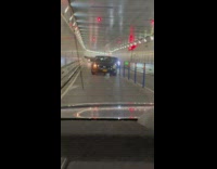 Car drives with long box sticking out 