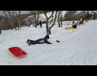 Pt. 2 Boy slides down snowy slope, flies off ramp and falls
