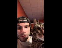 Man and cat meowing at each other