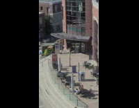 Man in gray jacket danced in front of the theatre