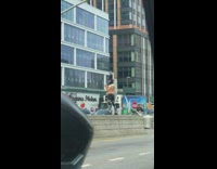 Black ski mask guy dances middle street 