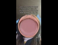 Woman in car round warped face filter