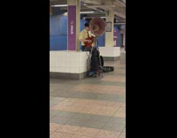 Man play guitar sing with large metal funnel