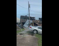 girl beanie selfie tornado rubble