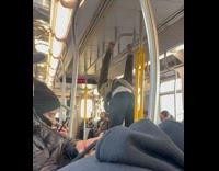 Man doing calisthenics inside subway