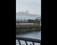 Woman lacrosse stick dance video shoot river dock