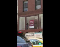 Guy plays violin in empty office for lease 