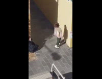 Woman brown jacket alleyway sunny weird pictorial