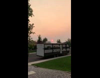 Pink orange sky red ring around sun