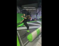 Girl at trampoline gym gets hit by obstacle course