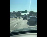 Man rides bike inside the highway