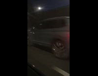 Guy rides ATV on freeway 