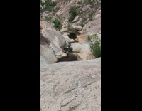 Girl black shorts lay pose water stream