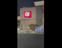 Guy gets out of car and shakes butt in front of woman 