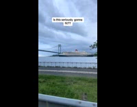 Huge cruise ship going under bridge