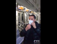 Guy face mask disinfectant spray someone coughs 