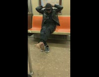 man with no shoes on puts head band on train
