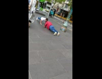Two men pushups and give hand five at the park