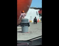 Man Kisses Giant Orange for Photo 