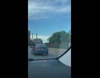 Woman bikes in freeway 