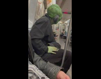 Alien sits on train 