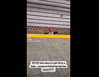 Woman climbs up from the railroad platform