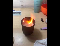 Person lit candle flame spread and crackle