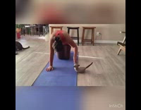 Woman does yoga with cats interrupting her, time lapse 