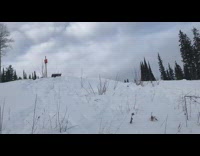 Skier jumps off ramp, frontflips and loses skis