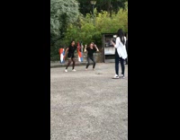 Two women tiktok dance road colorful post